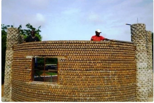 UNUSUAL HOME. THIS GUY BUILT HIS OWN HOUSE OUT OF PLASTIC BOTTLES